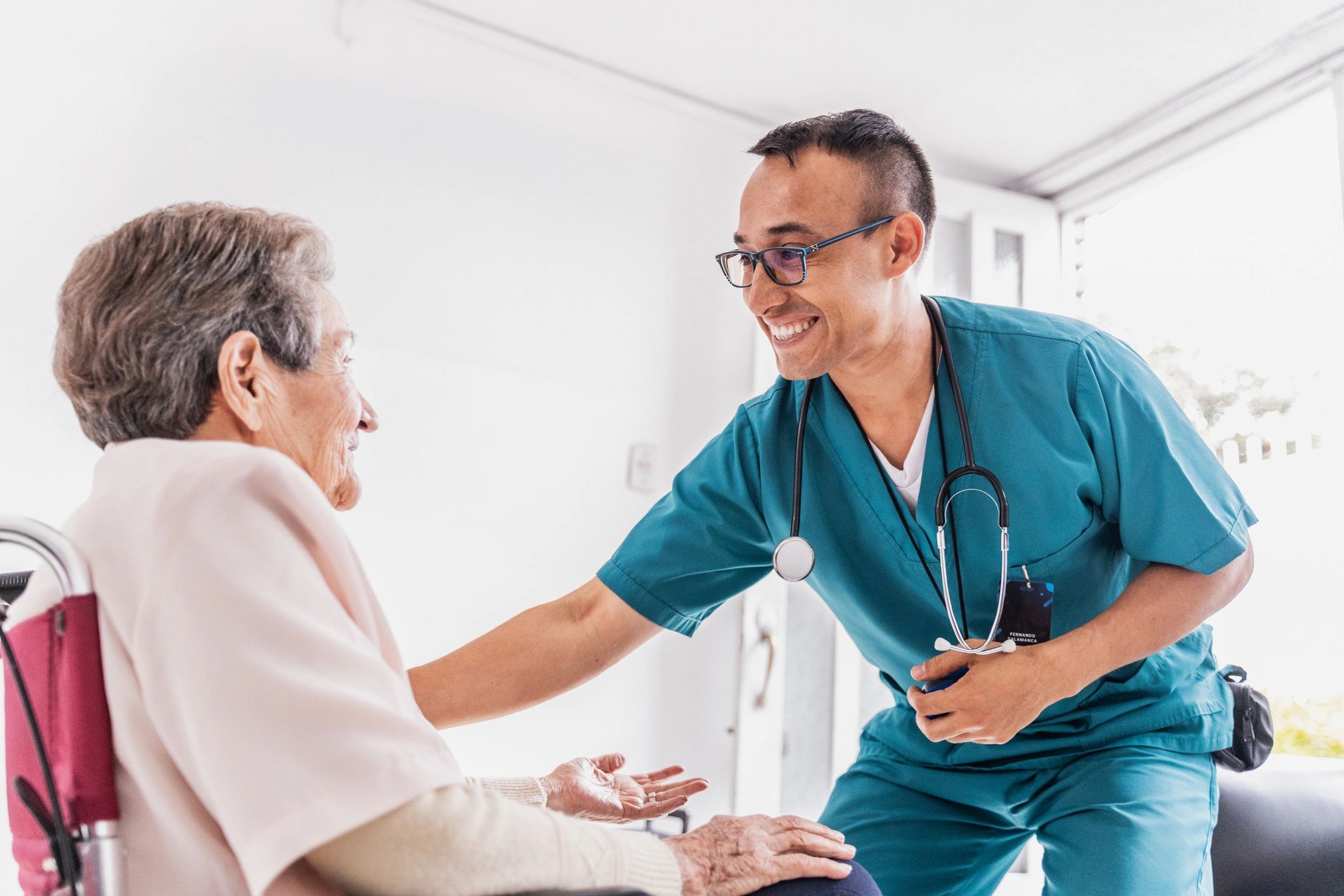 Clinician providing care to a senior resident in a facility