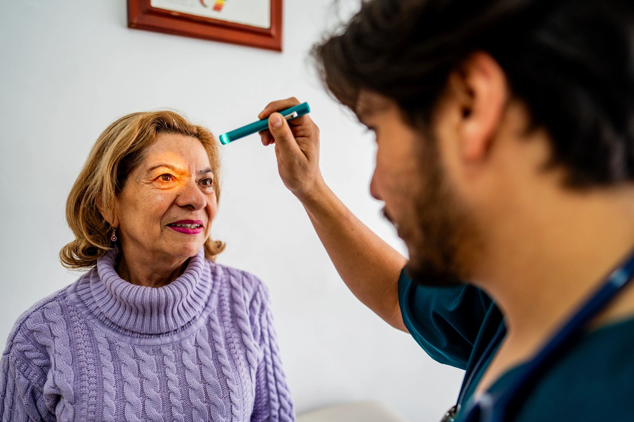 Doctor examining a senior patient’s eyes
