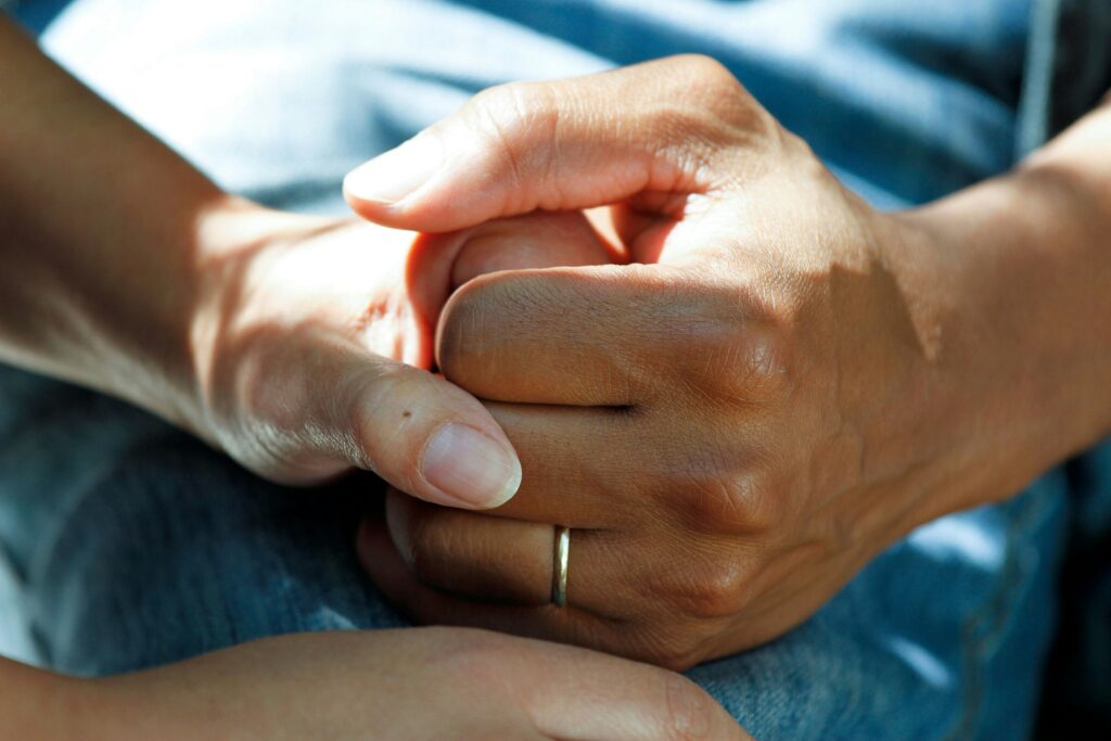 

Audiologist fitting a senior resident with a hearing aid during an on-site care visit